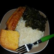 la-food-bank_my-favorite-meal-MyFavoriteMeal-1-180x180 A plate of food from the Los Angeles Regional Food Bank featuring rice, collard greens, cornbread, and a piece of salmon, with a green-handled fork resting on the side.