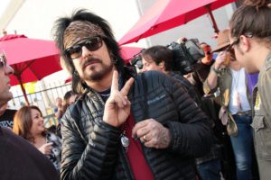 Nikki Sixx giving peace sign
