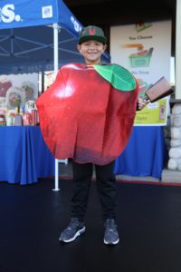 Young man in apple costume at KTLA take 5 to care