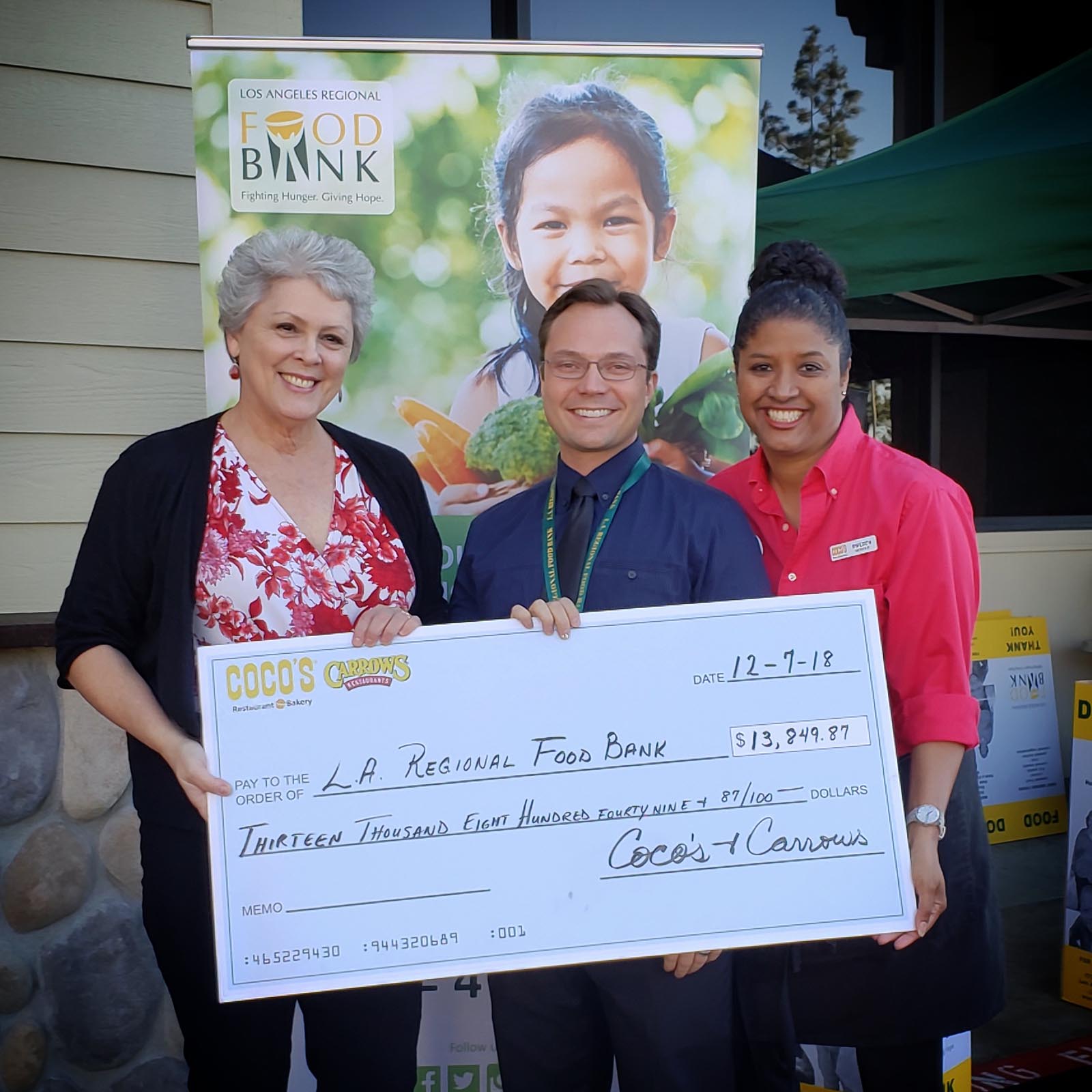 Coco's and Carrow's check presentation with Joan Hansen and David May
