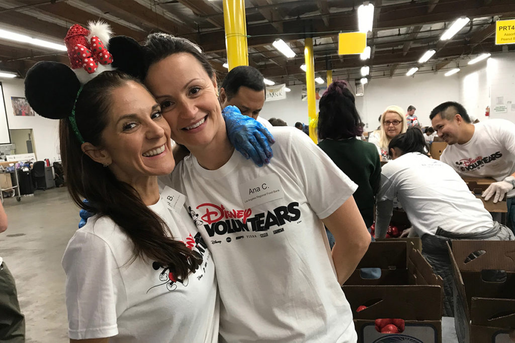 lafb-top-volunteer-1024x683 two volunteers smiling in warehouse