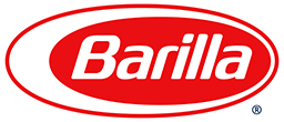 DEF_LOGO_BARILLA_US_NEW_R_outilne The image features the Barilla logo, displaying its brand name in white italic letters within a red oval shape with a white border. This emblematic design has partnered with the Los Angeles Regional Food Bank to support community food initiatives.