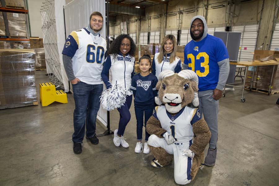 Rams players cheerleaders and mascot