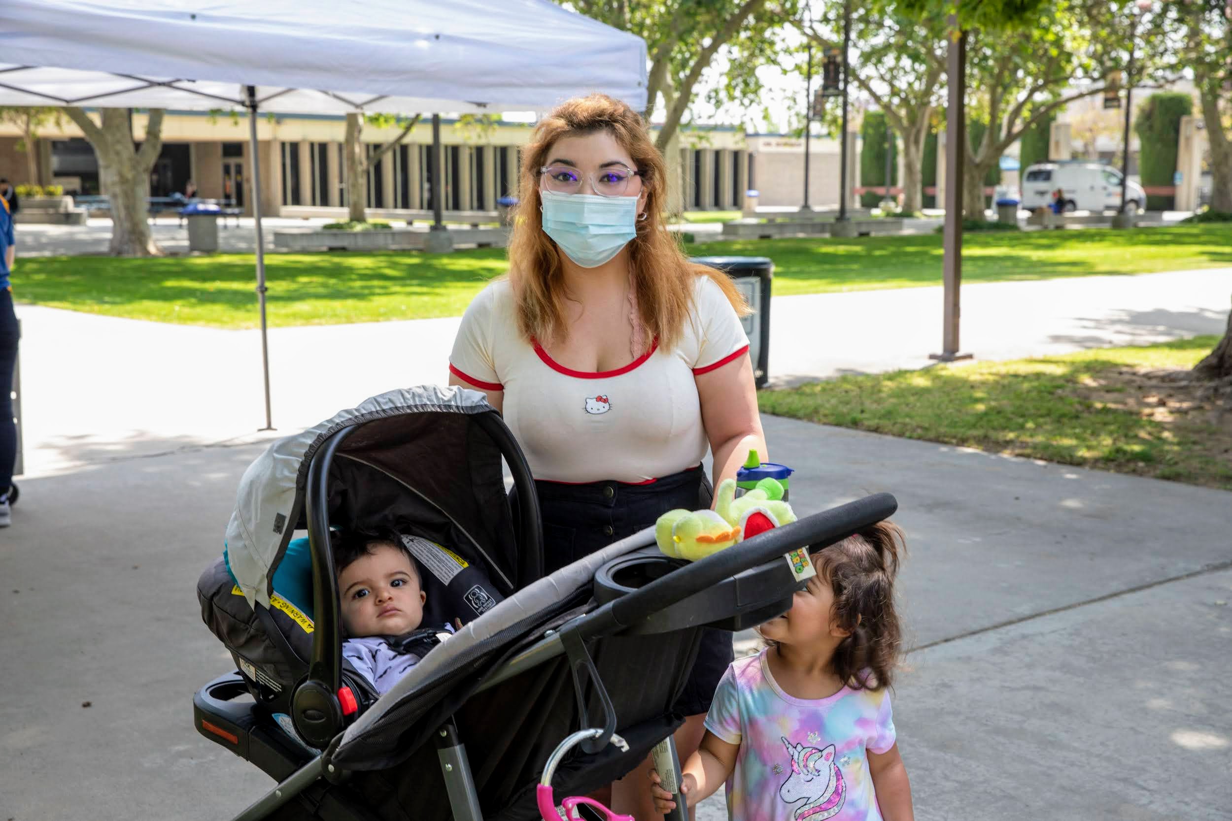 A mother and her two children at a distribution at Citrus College