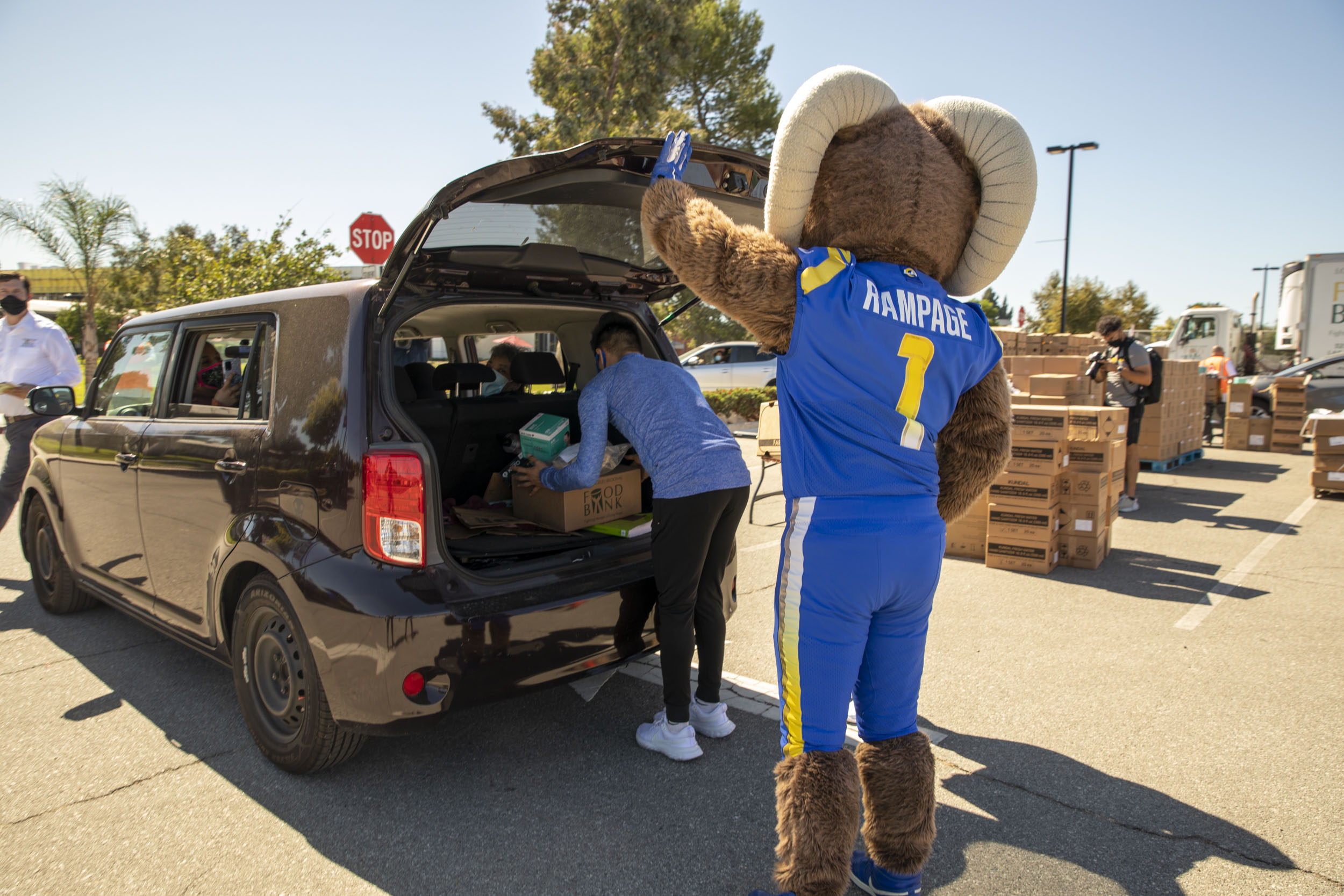 Rampage loads food into a recipient's car