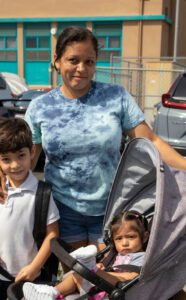 A mother with her young son and infant daughter at Mayo Elementary