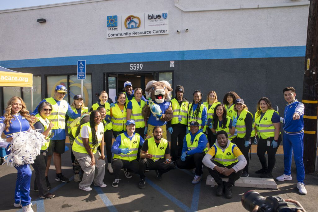 Tutu Atwell and the LA Rams at a Thanksgiving distribution in Long Beach